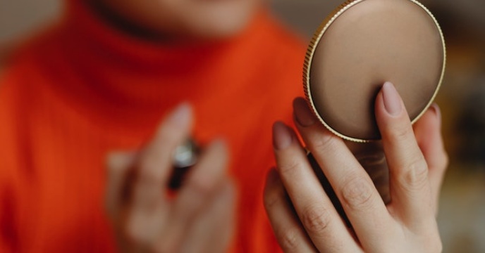 Woman looking in a markup mirror