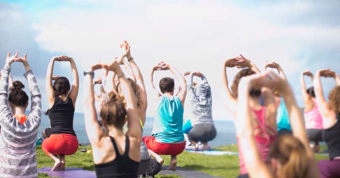 People doing outdoor yoga