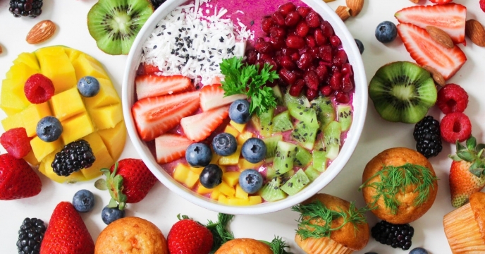 Fresh fruits around a bowl